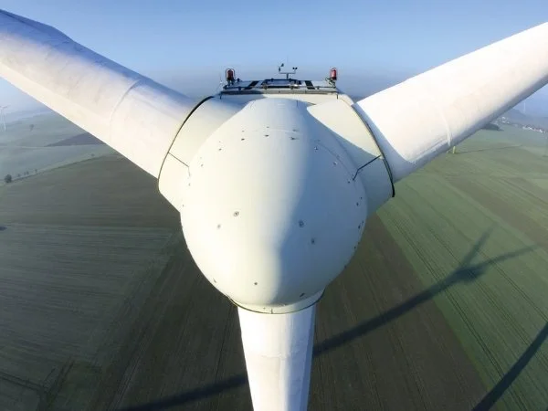 wind turbine close up on a green landscape background