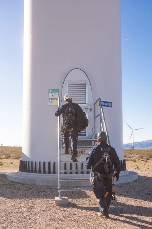 Mersen wind generator maintenance team entering a wind tower